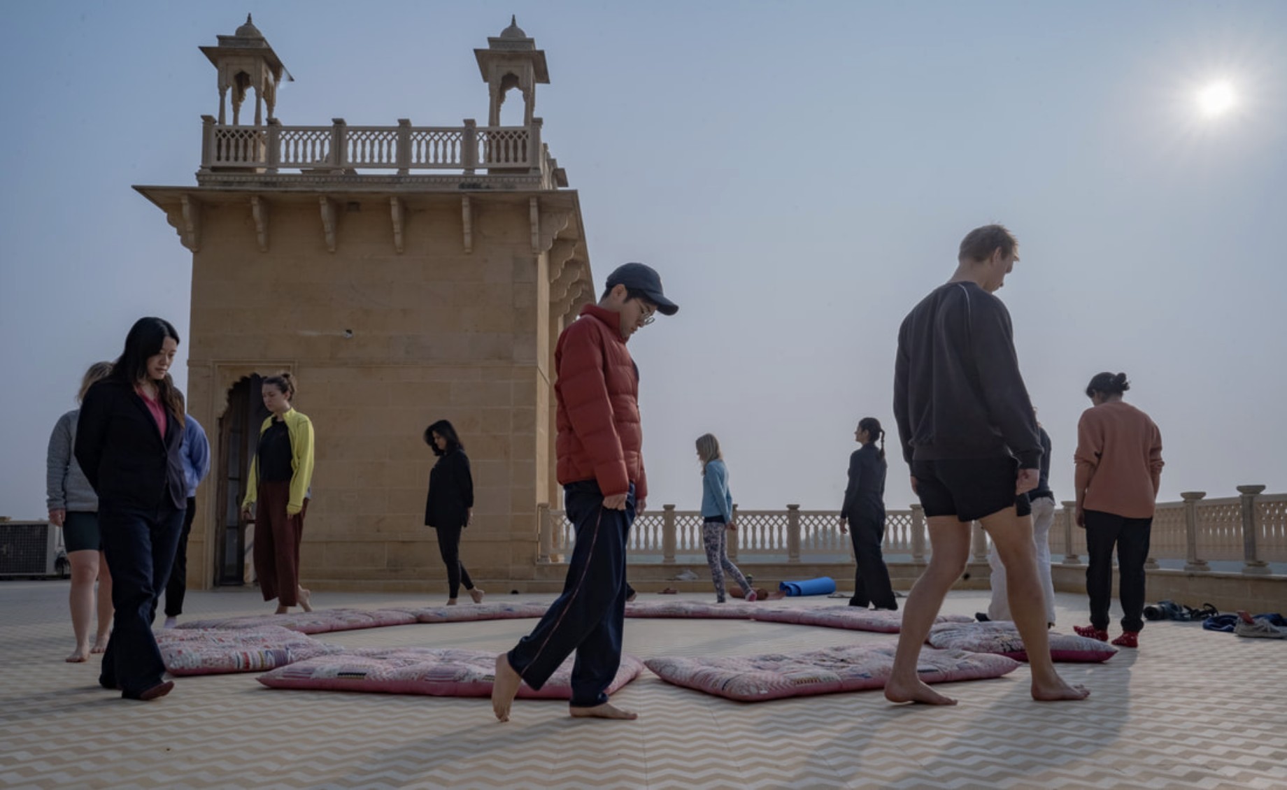 Erin leading a walking meditation on a rooftop retreat in India
